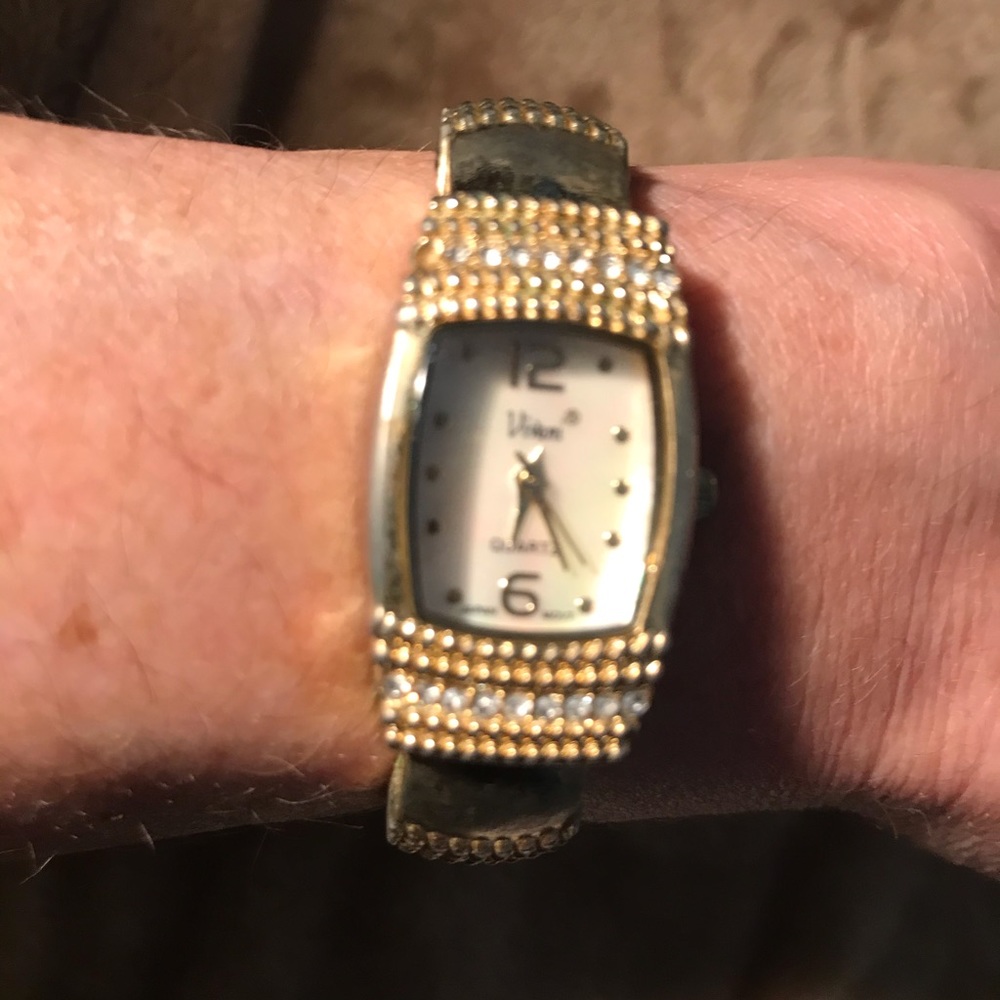 Ladies cuff watch with rune stones